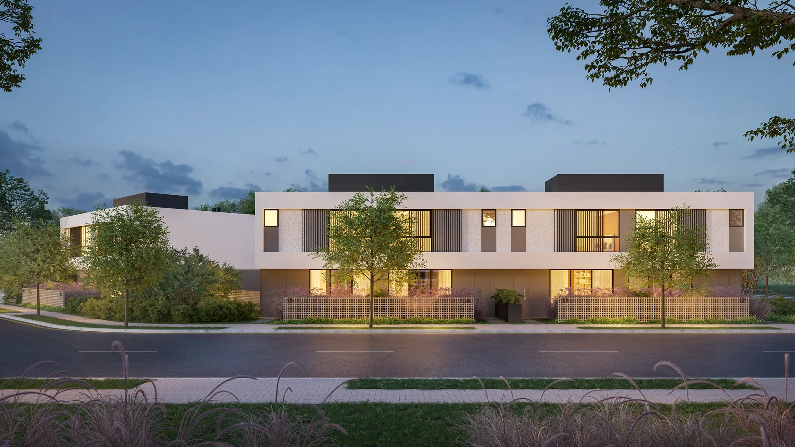 Fachadas das Casas Pátio ao entardecer, integradas aos jardins e à rua